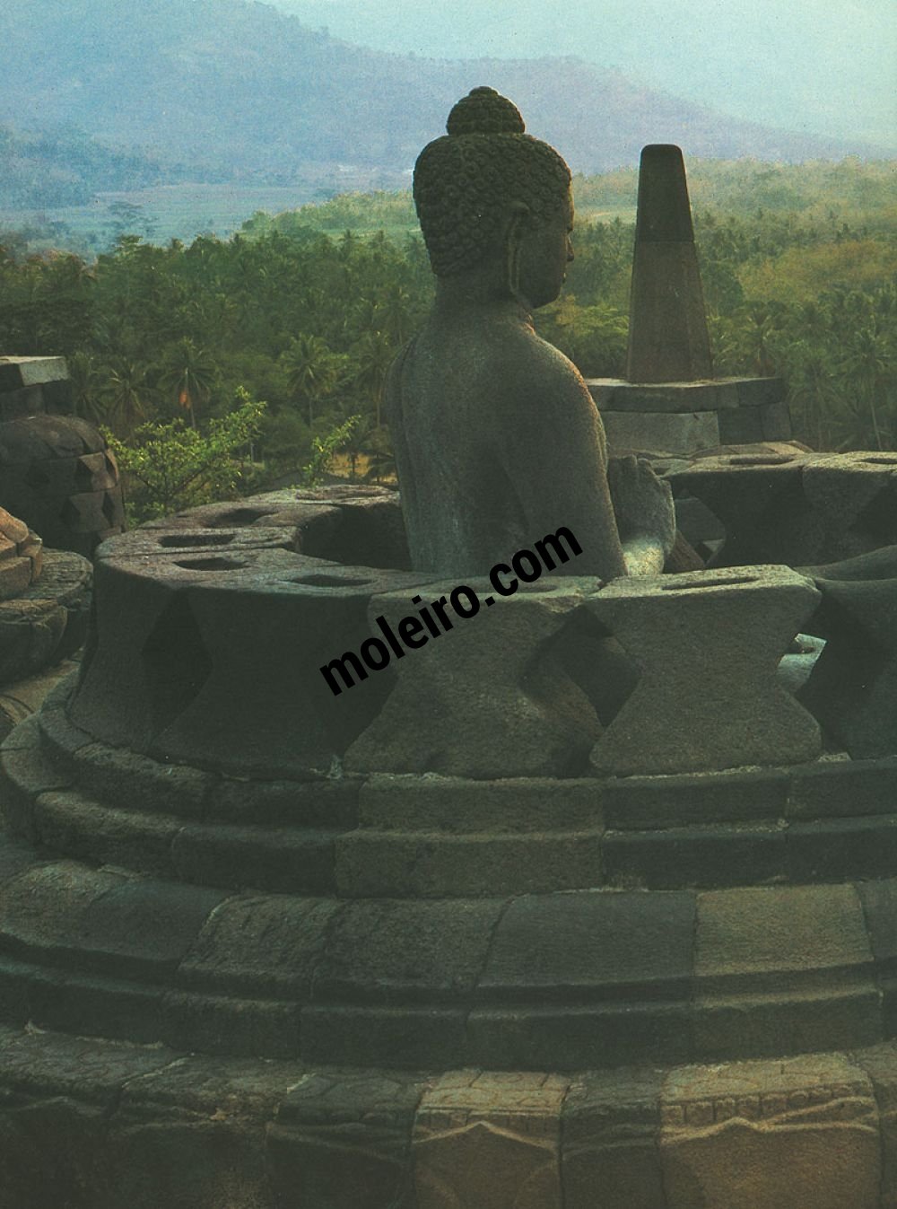 Borobudur Round terrace with perforated stupa. Image of Vairocana, the supreme Buddha.